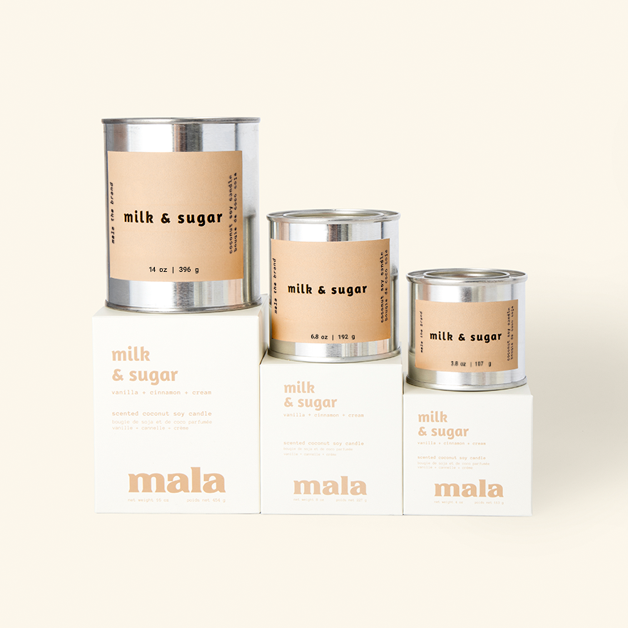 Three 'milk & sugar' containers with labels on a white background