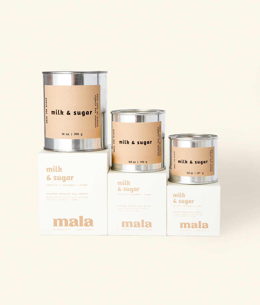 Three 'milk & sugar' containers with labels on a white background