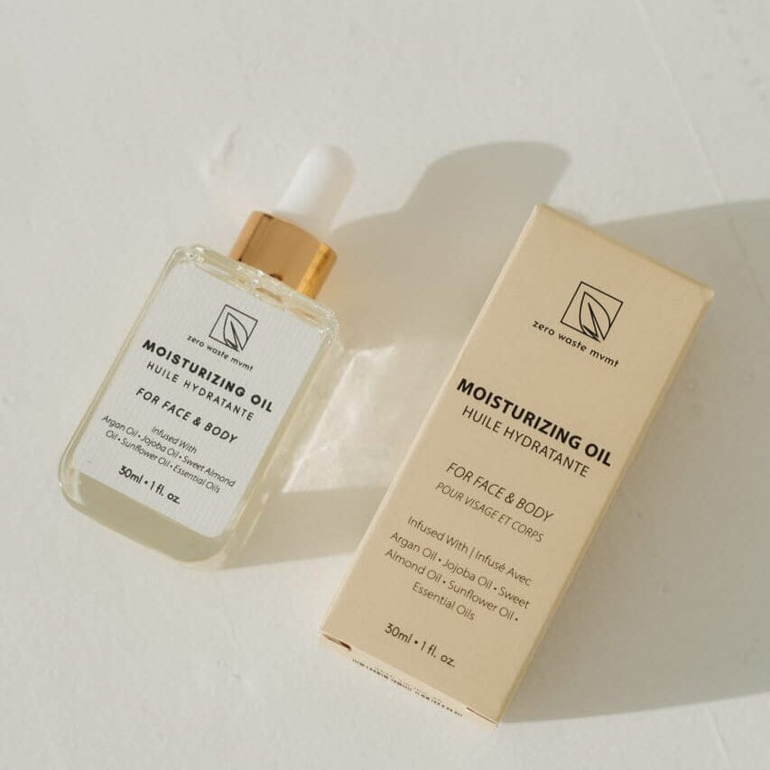 Moisturizing oil bottle and packaging on a light background