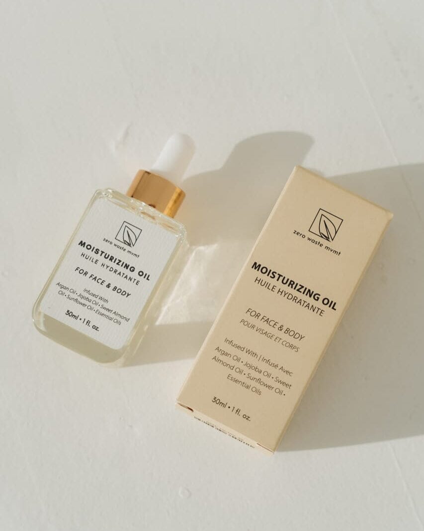 Moisturizing oil bottle and packaging on a light background