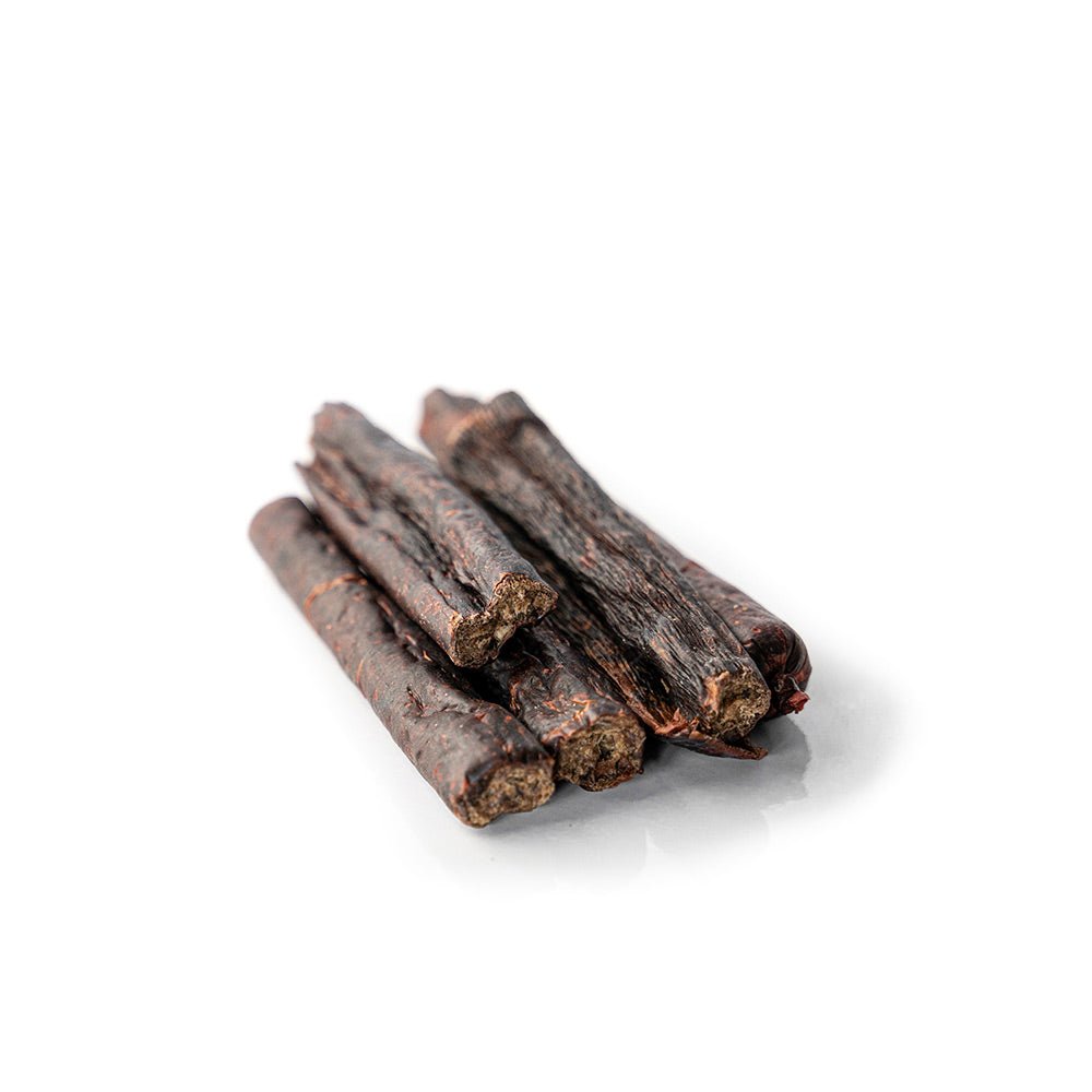Five dark brown sticks on a white background