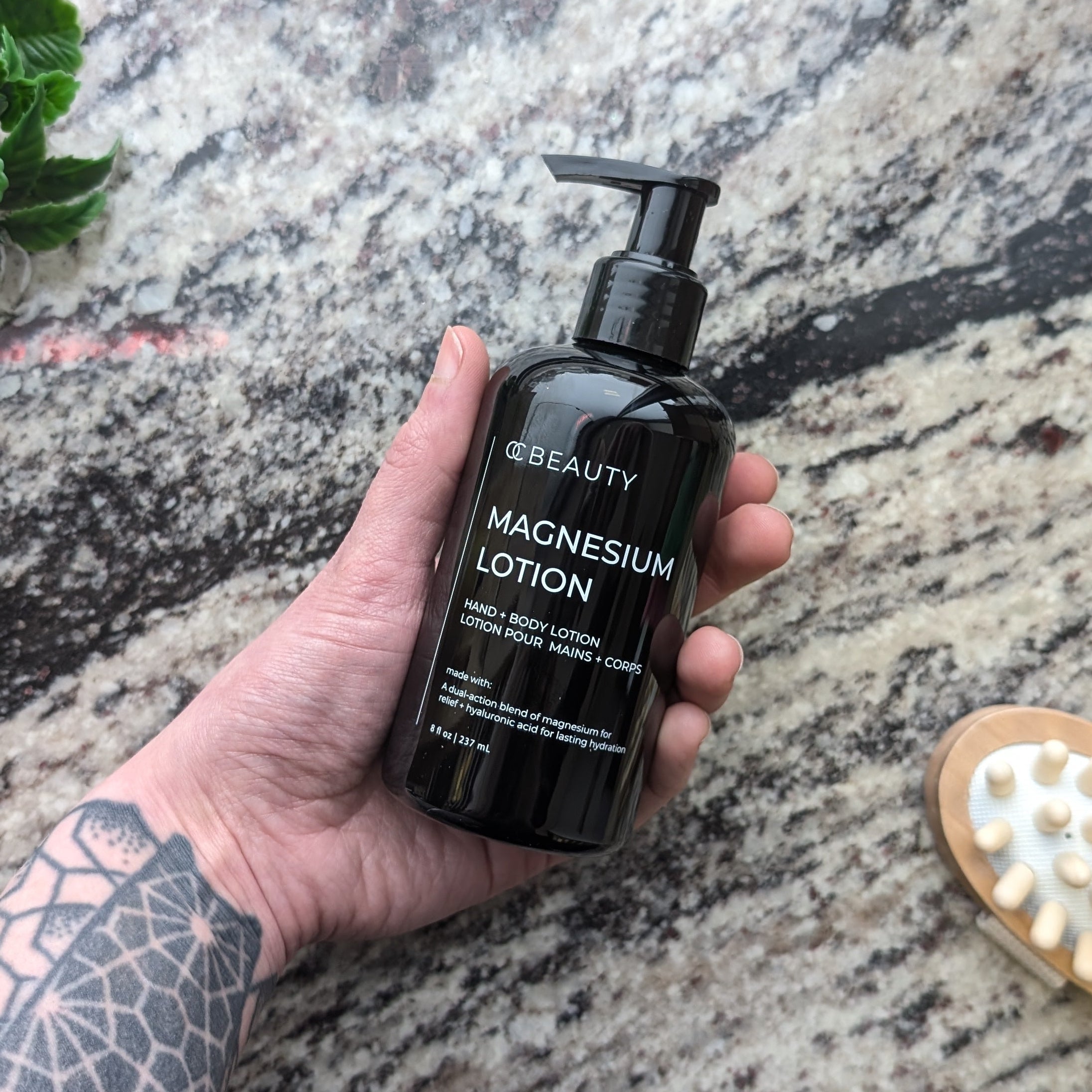 Black bottle of OC Beauty Magnesium Hand & Body Lotion 