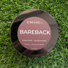 Shave soap container labeled 'Bareback' by OC Beard Co. on a grass background