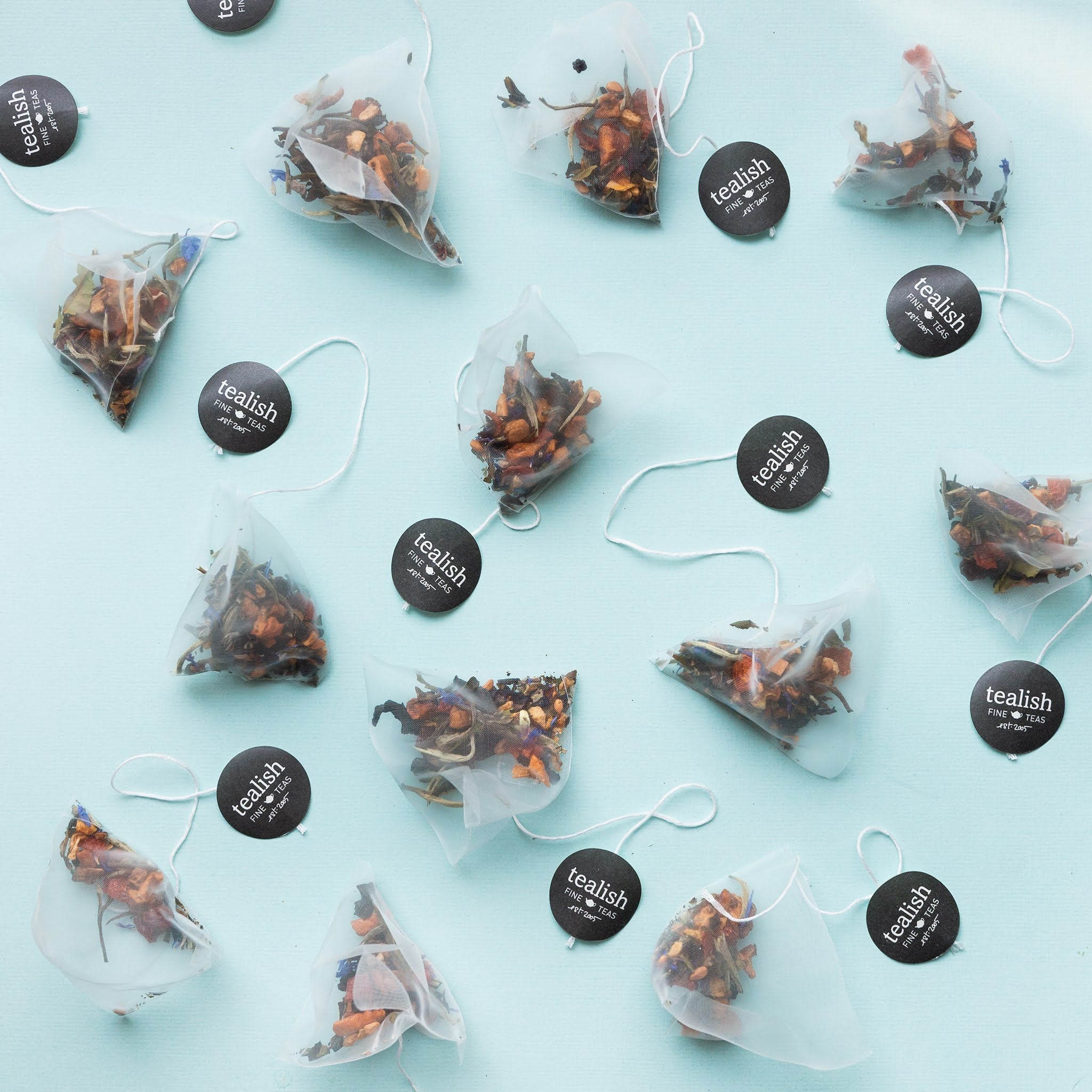 Tea bags with visible brand 'tealish' on a light blue background