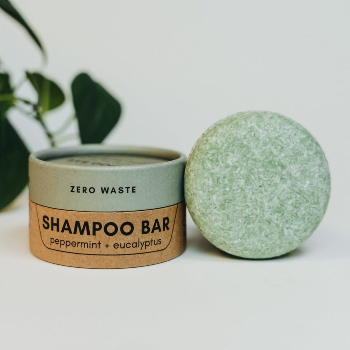 Shampoo bar with packaging on a white background