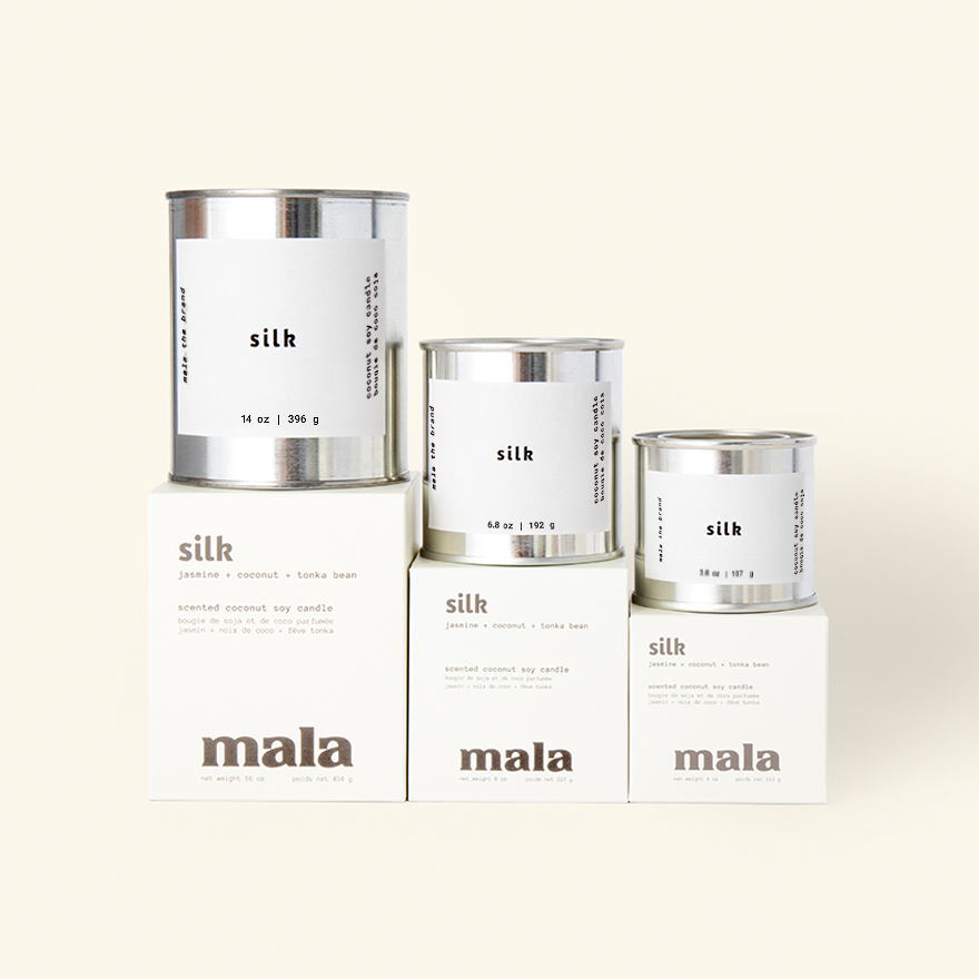 Three containers of 'mala silk' on a white background