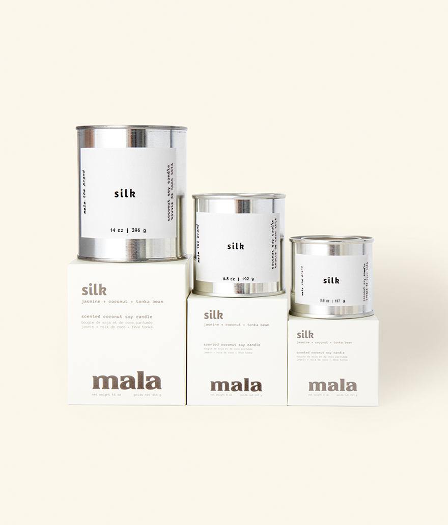 Three containers of 'mala silk' on a white background