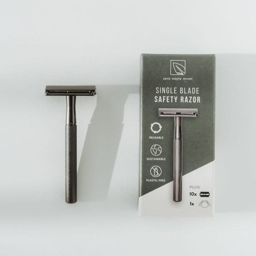 Single blade safety razor with packaging on a white background