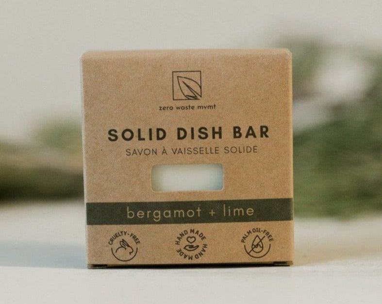 Solid dish bar packaging with 'zero waste' branding on a neutral background