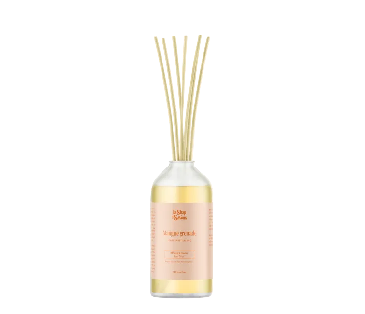 Diffuser bottle with reeds on a white background