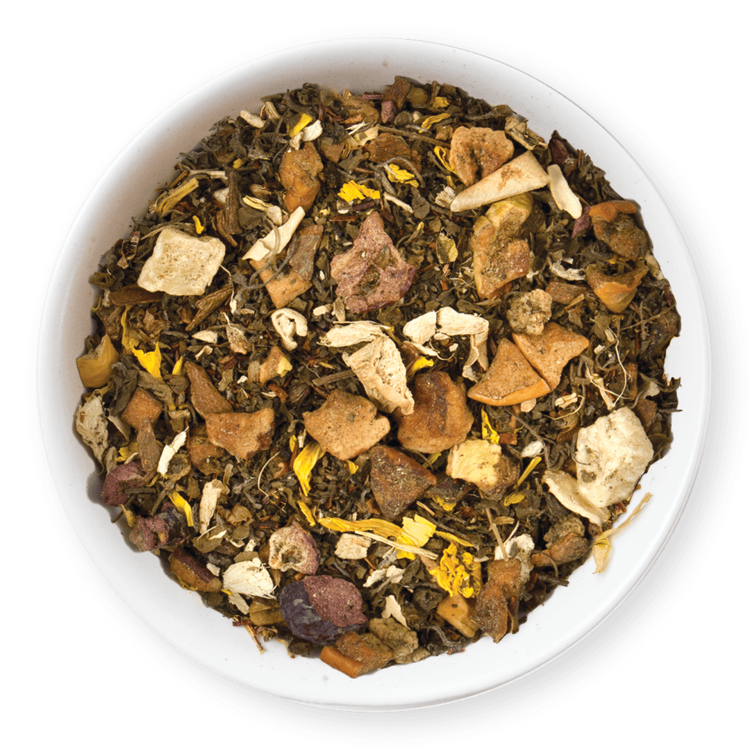 Assorted dried herbs and leaves in a white bowl on a dark background