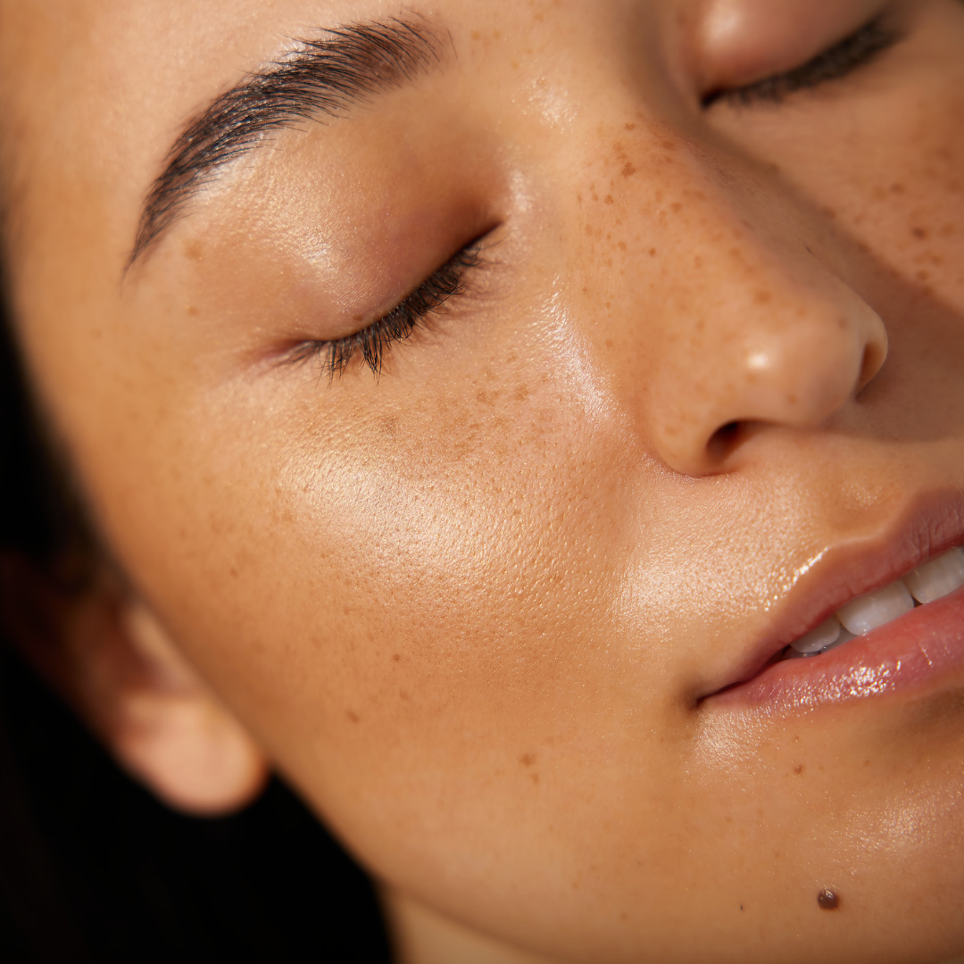 Close-up of a person's face with LisaNoto Mineral Bronzer 12g – Natural Sun-Kissed Finish
