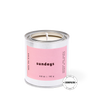 Candle in a metal tin with a pink label on a white background