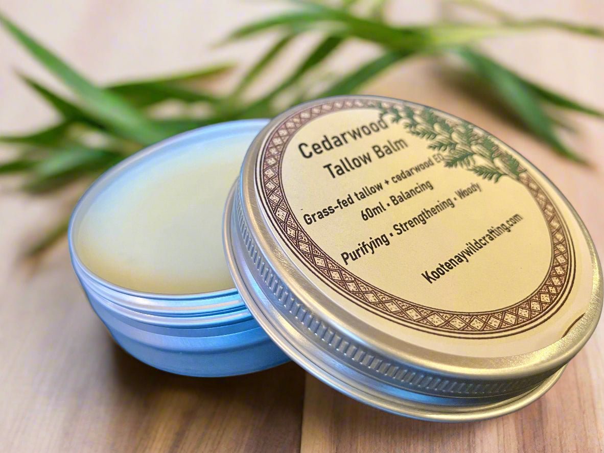 Cedarwood tallow balm container with lid on a wooden surface