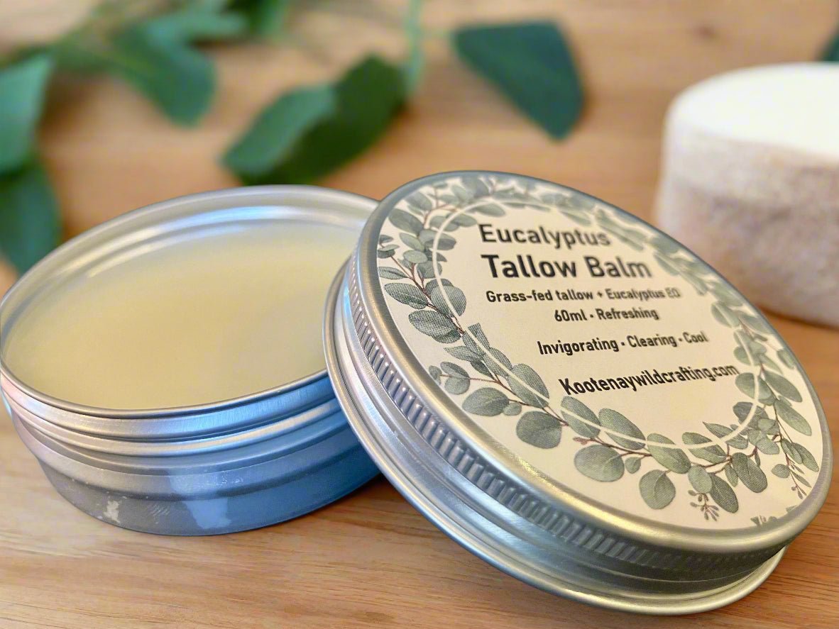 Eucalyptus Tallow Balm tin with a decorative label on a wooden surface.