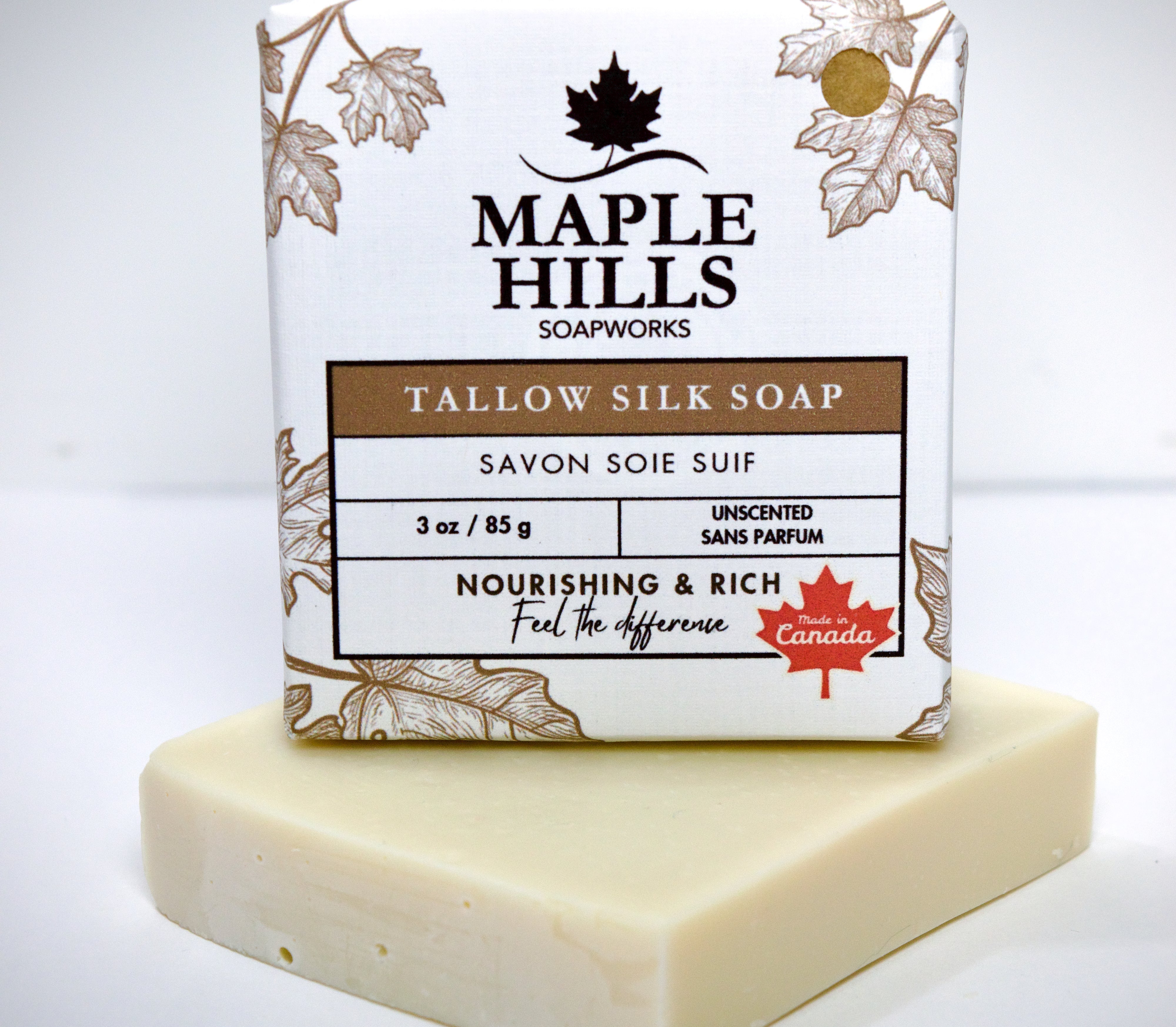 Bar of soap with Maple Hills Soapworks packaging on a white background
