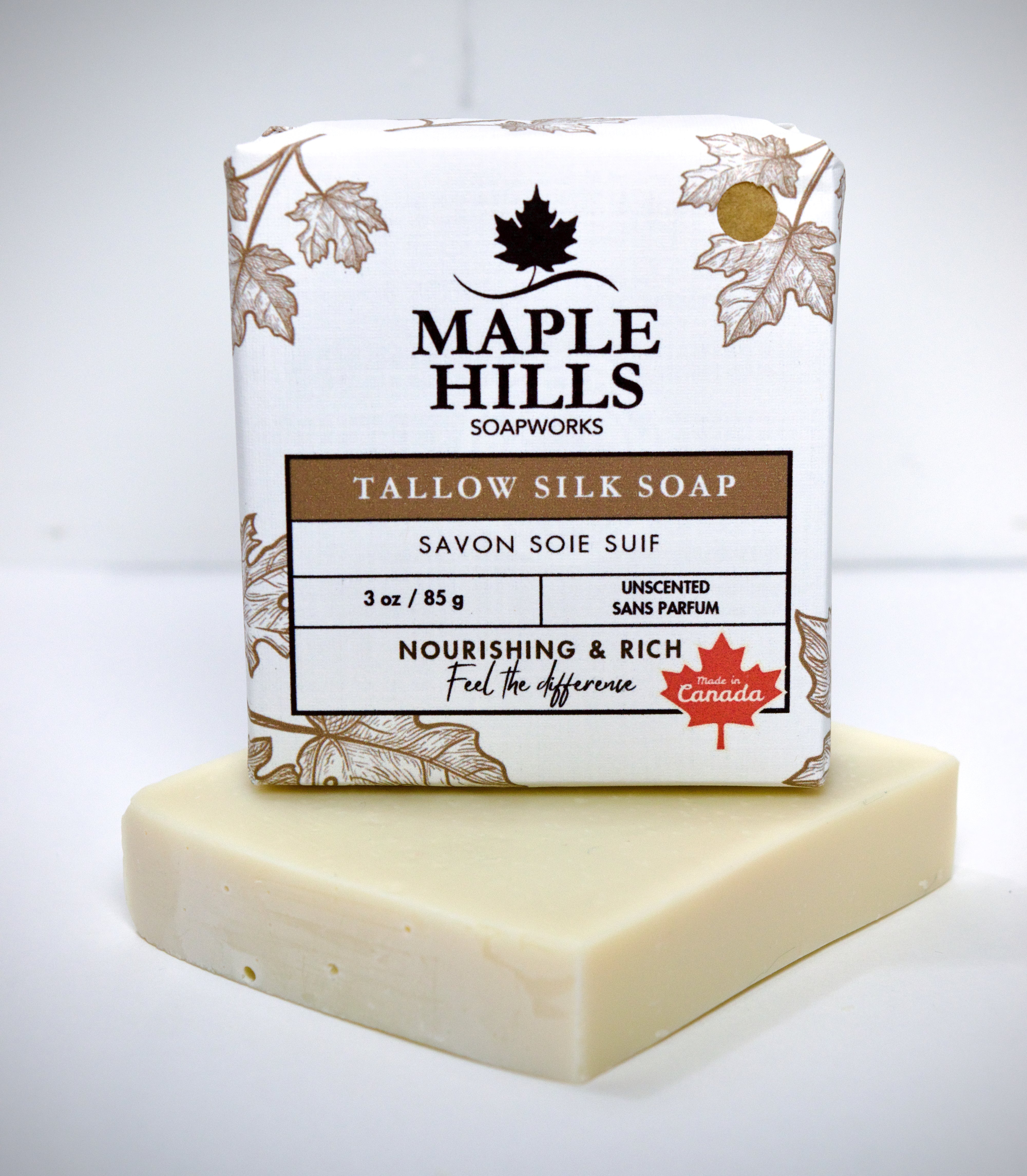 Bar of soap with Maple Hills Soapworks packaging on a white background