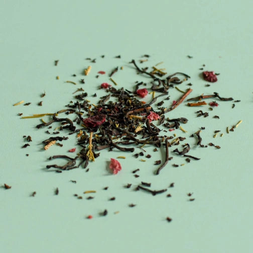 loose tea leaves with cranberry and fir leaves