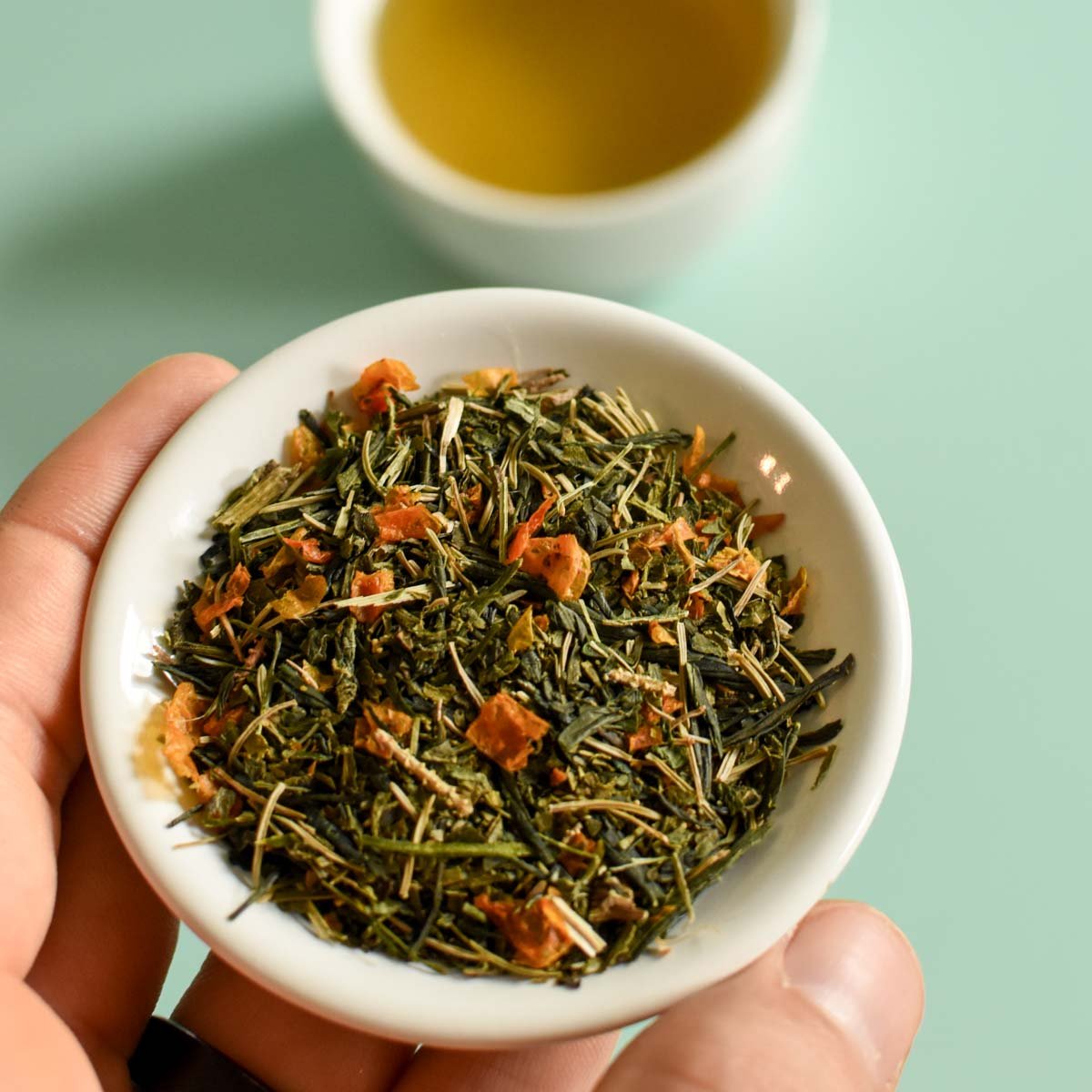White bowl filled with green tea leaves Sencha Green Tea – Wild Nettle & Black Spruce | Floèm