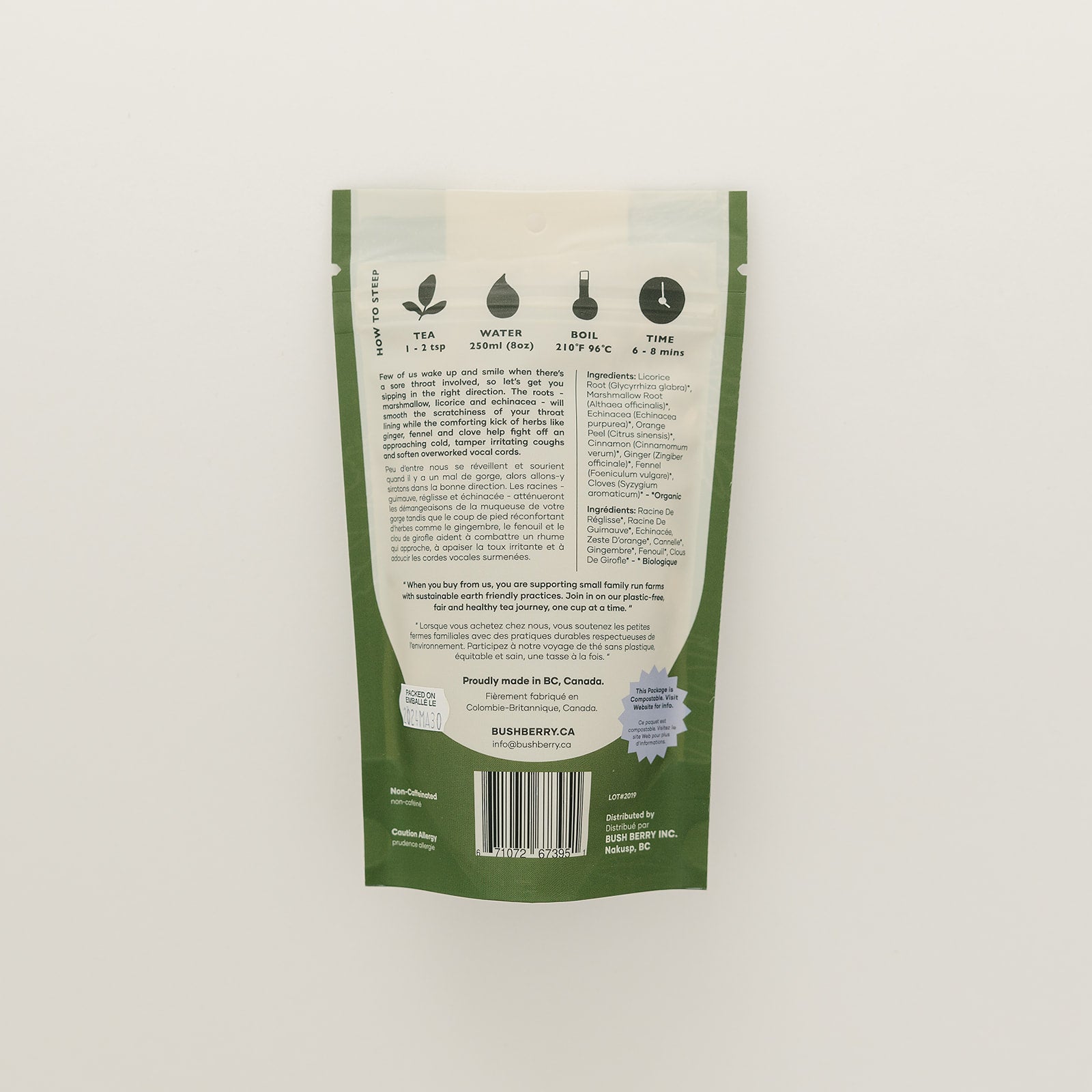 Green and white package with text and branding on a light gray background