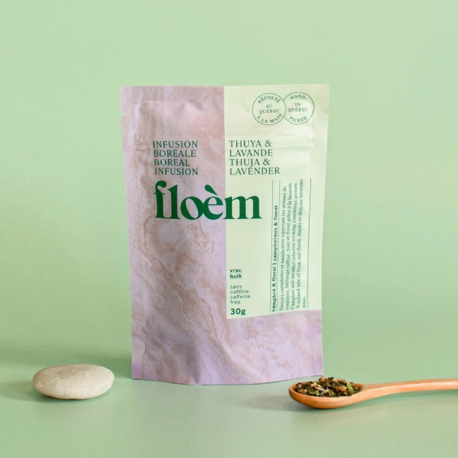 Floèm Thuya and Lavender herbal tea loose leaf packaging with a spoon