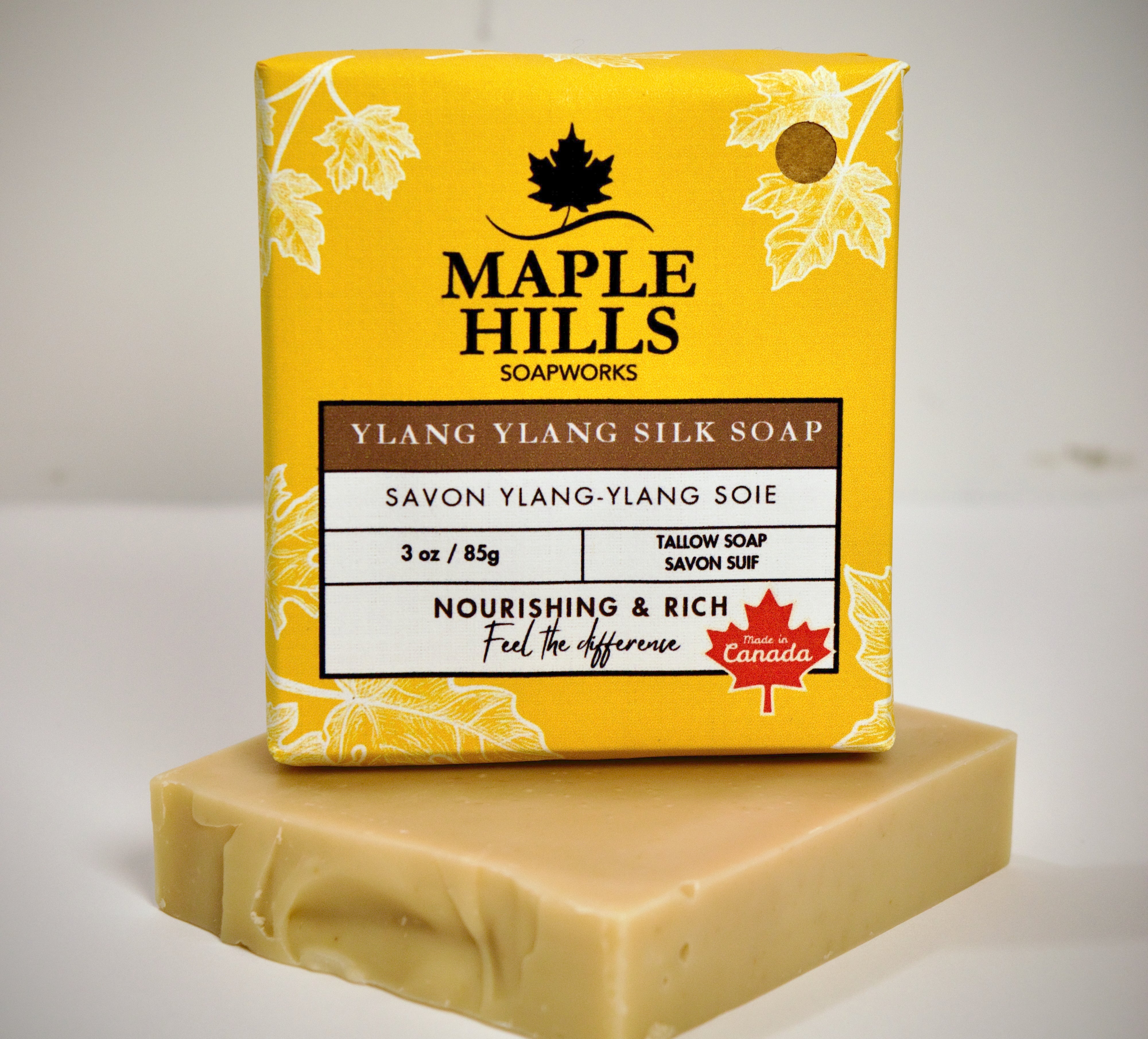 Bar of soap with Maple Hills Soapworks packaging on a white background