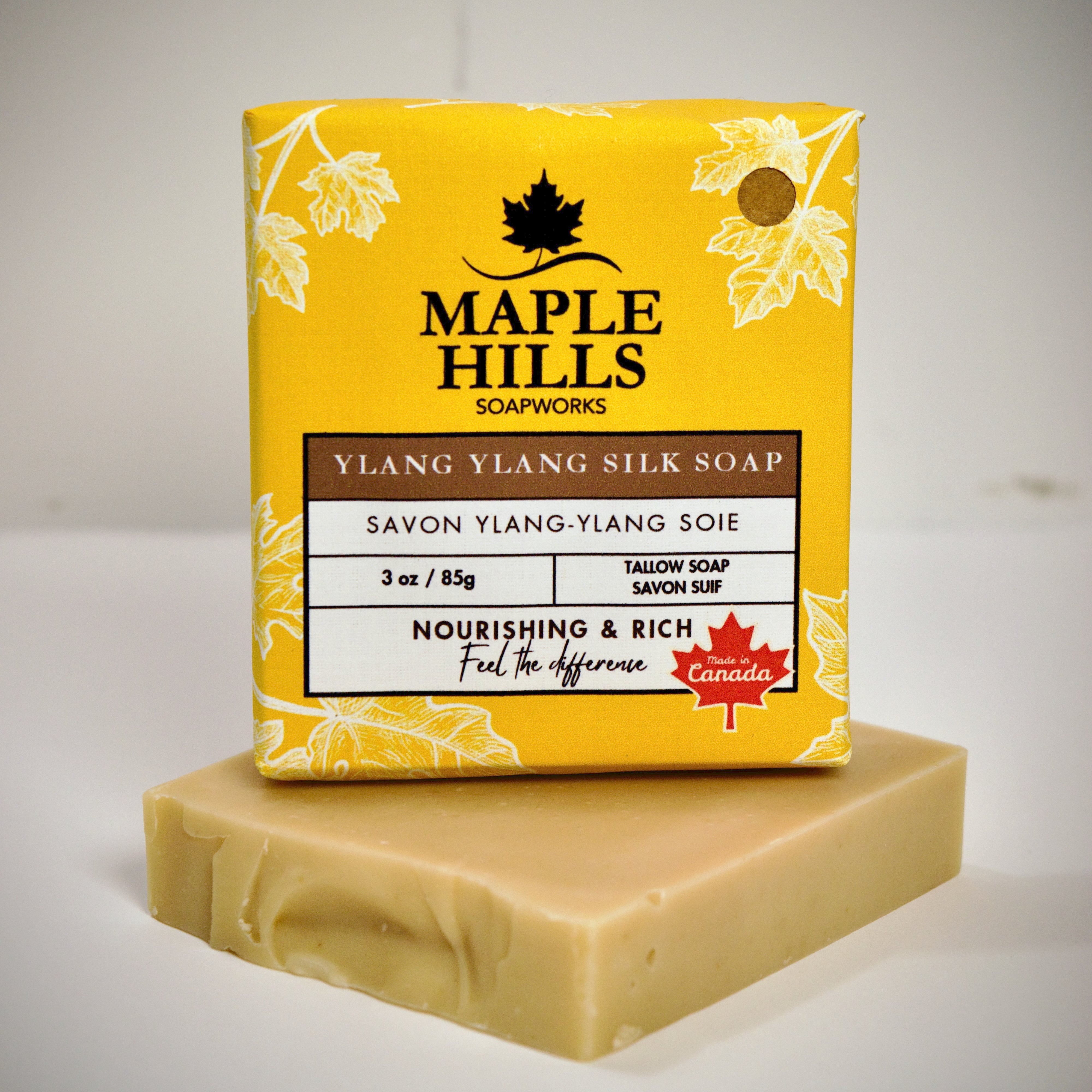 Bar of soap with Maple Hills Soapworks packaging on a white background